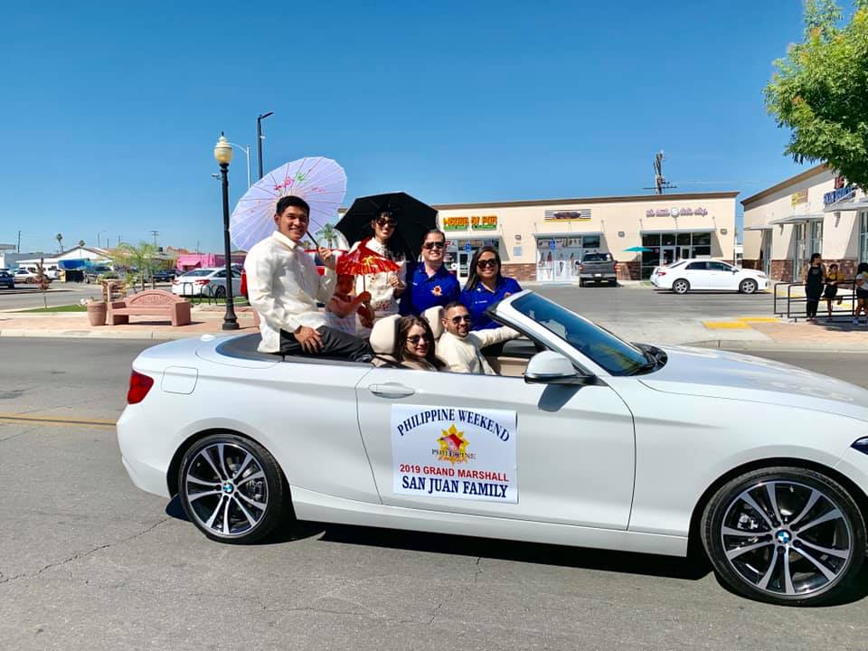 Photo showing the grand marshall of the Philippine Weekend parade in Delano, California, sponsored by the Delano Chamber of Commerce.